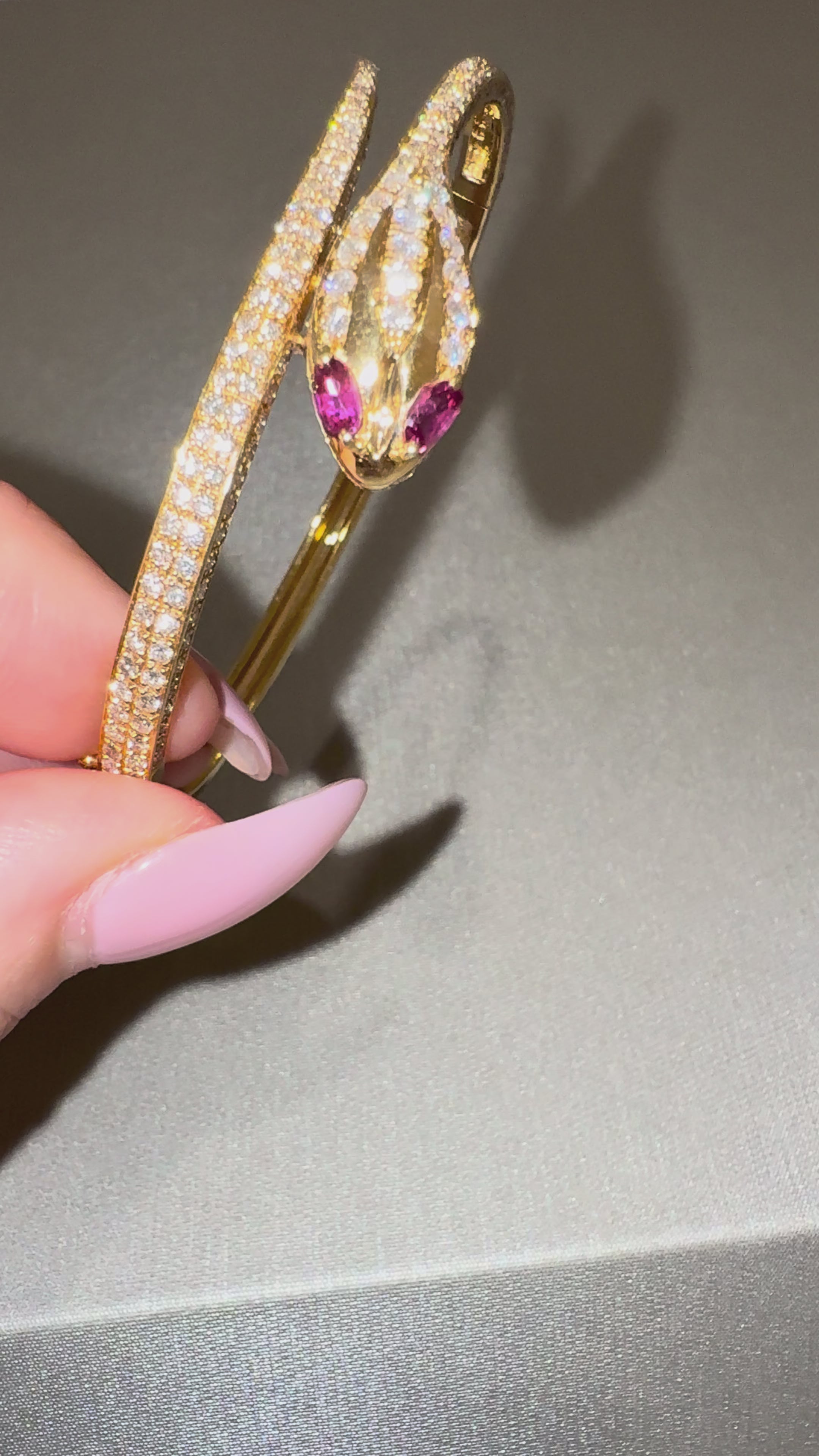 Snake Bangle in motion — diamond-set yellow gold snake bracelet with ruby eyes — ELUL by Elizabeth
