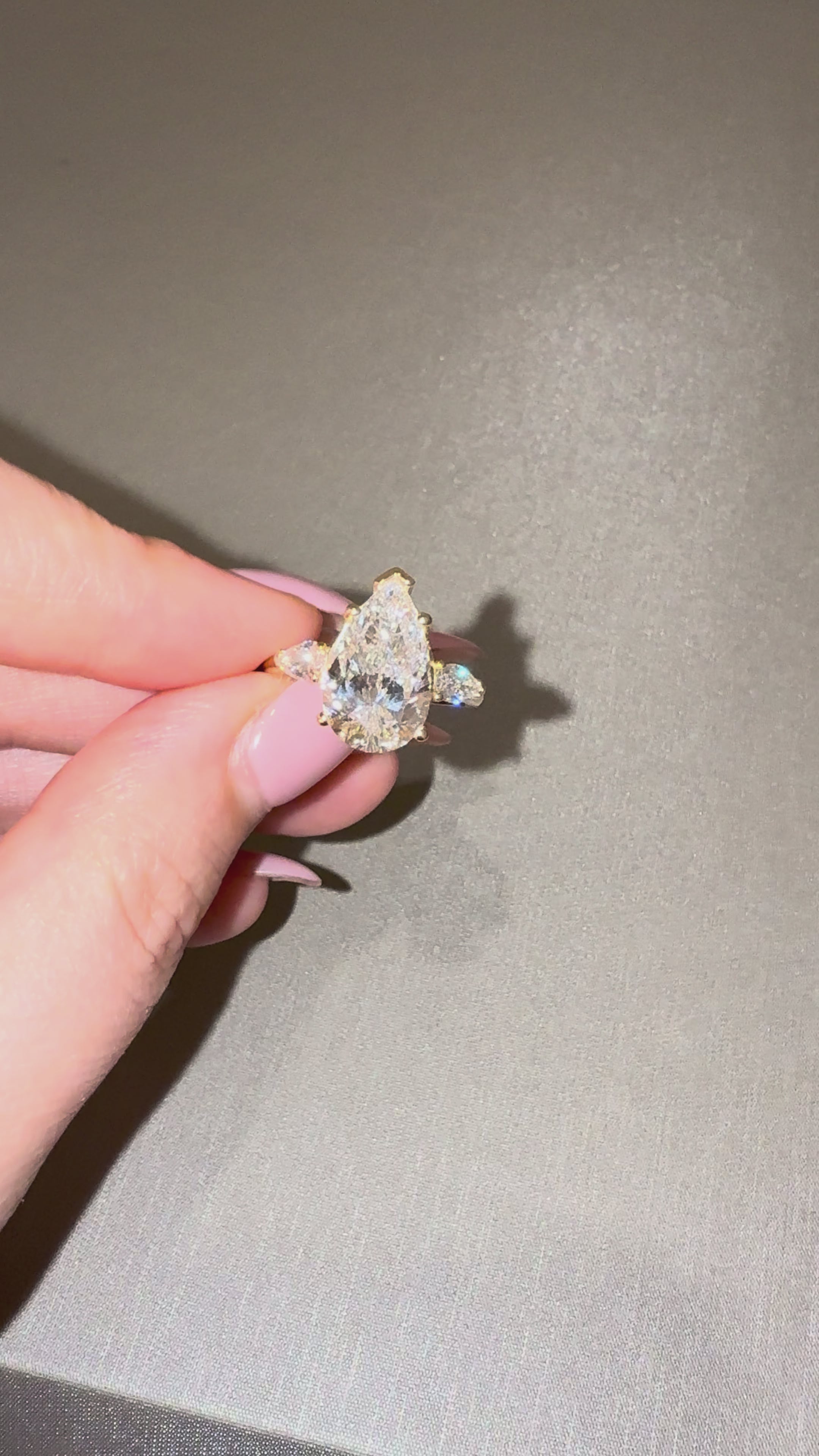Ness Pear Three Stone Engagement Ring close-up — pear lab diamond with side stones, yellow gold — ELUL by Elizabeth