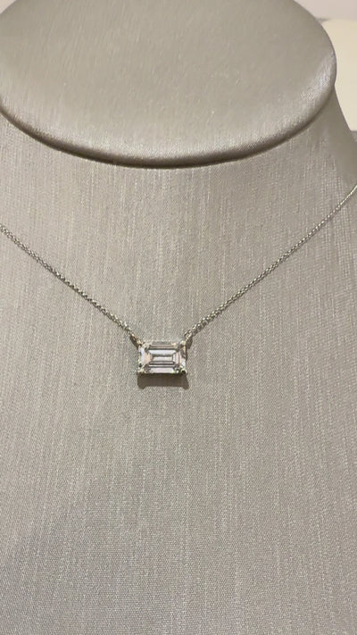 Muse Emerald Bezel Necklace worn on neck — 2 ct emerald-cut lab diamond, yellow gold bezel — ELUL by Elizabeth