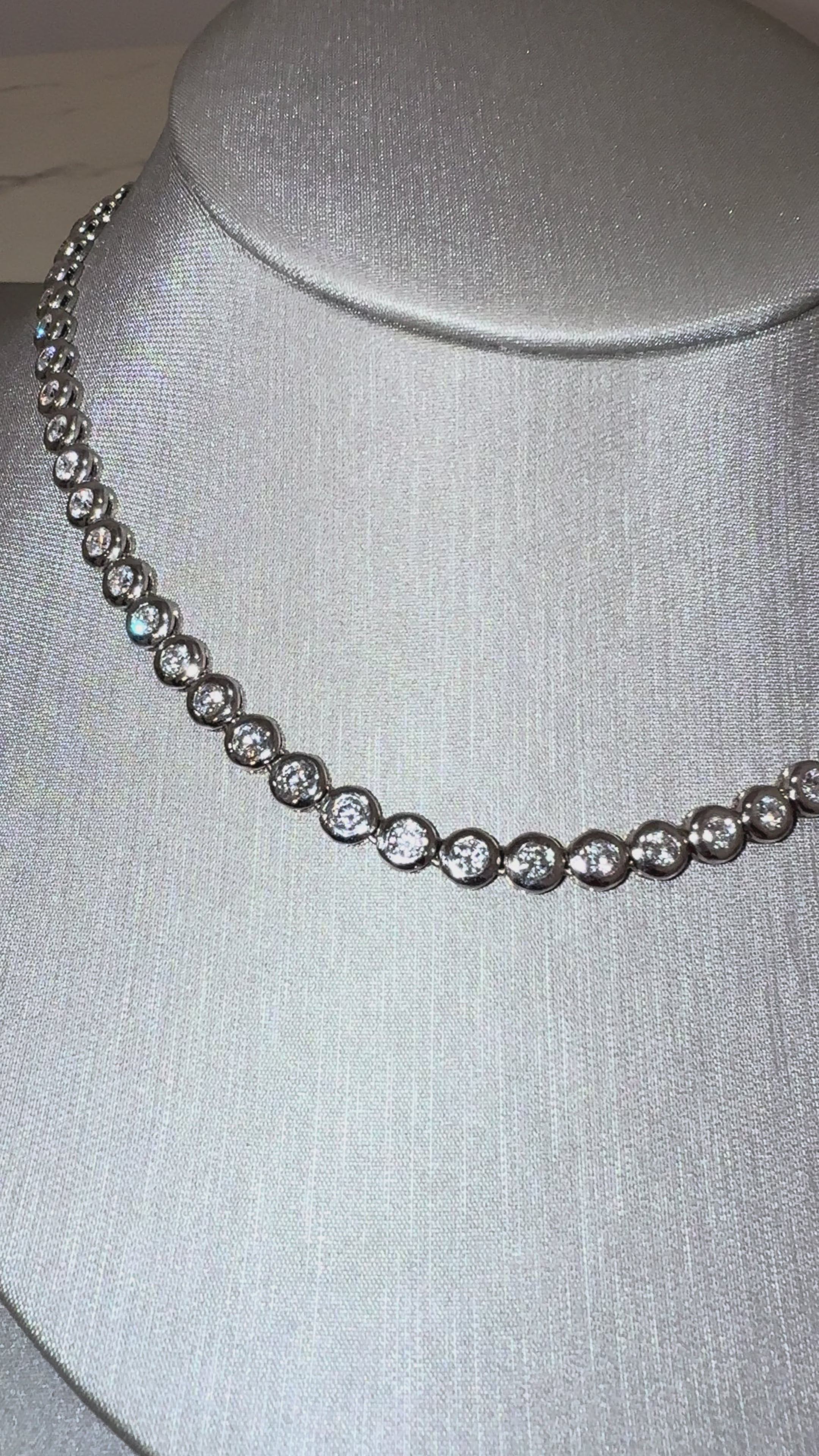 Bina Bezel Tennis Necklace worn on neck — 10 ctw bezel-set lab diamonds, white gold — ELUL by Elizabeth
