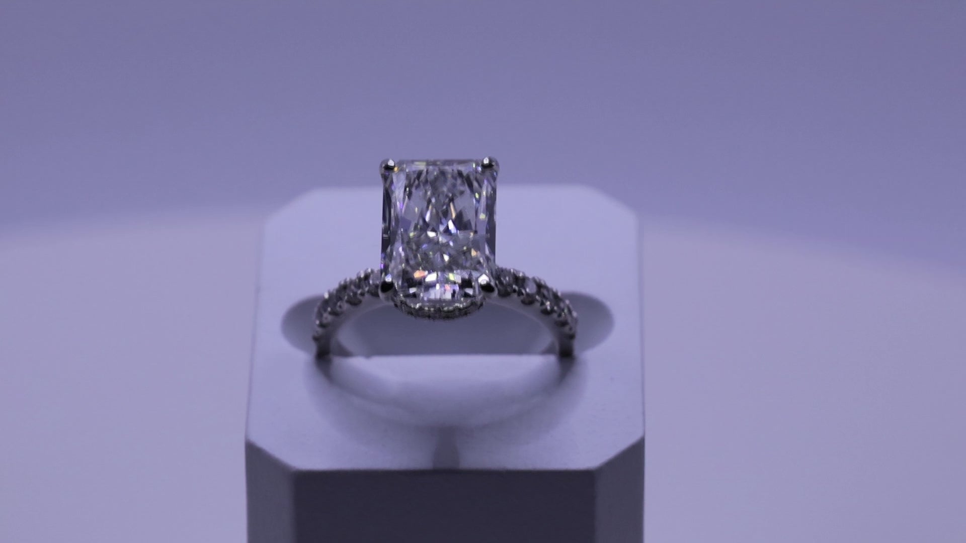 Ness Emerald Engagement Ring in motion — emerald-cut diamond, white gold setting — ELUL by Elizabeth