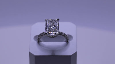 Ness Emerald Engagement Ring in motion — emerald-cut diamond, white gold setting — ELUL by Elizabeth