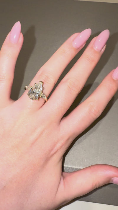 Ness Pear Three Stone Engagement Ring worn on hand — 3.87 ct IGI pear lab diamond, yellow gold — ELUL by Elizabeth