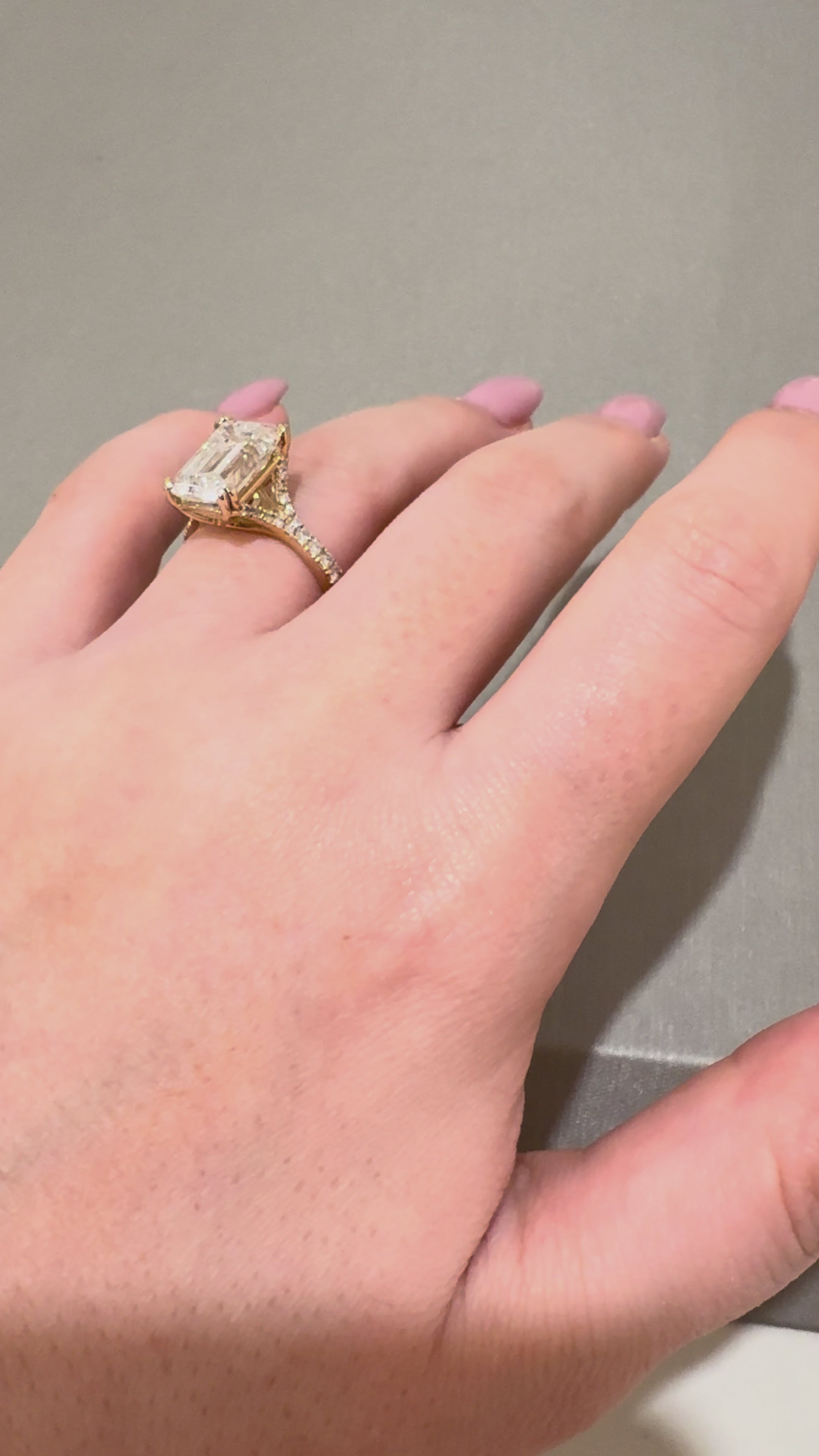 Ness Emerald Yellow Gold Solitaire Ring worn on hand — 5.09 ct IGI emerald-cut lab diamond, E VS1 — ELUL by Elizabeth